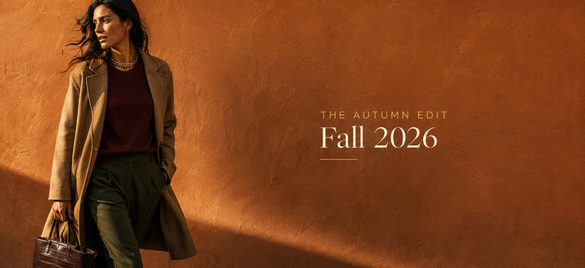 Fall 2026 desktop banner with woman in camel coat carrying a chocolate tote against an ochre wall