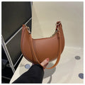 Arcelle Half-Moon Shoulder Bag — Brown