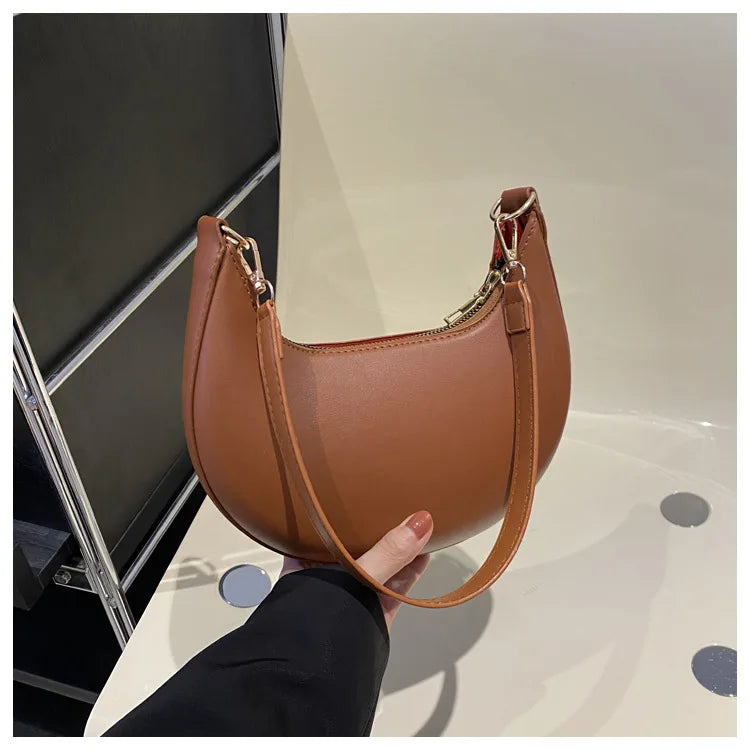 Arcelle Half-Moon Shoulder Bag — Brown